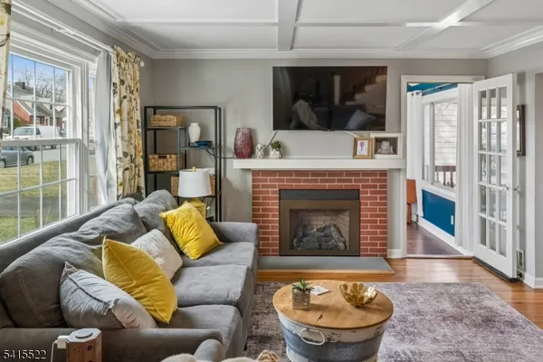 a living room with furniture and a dining table