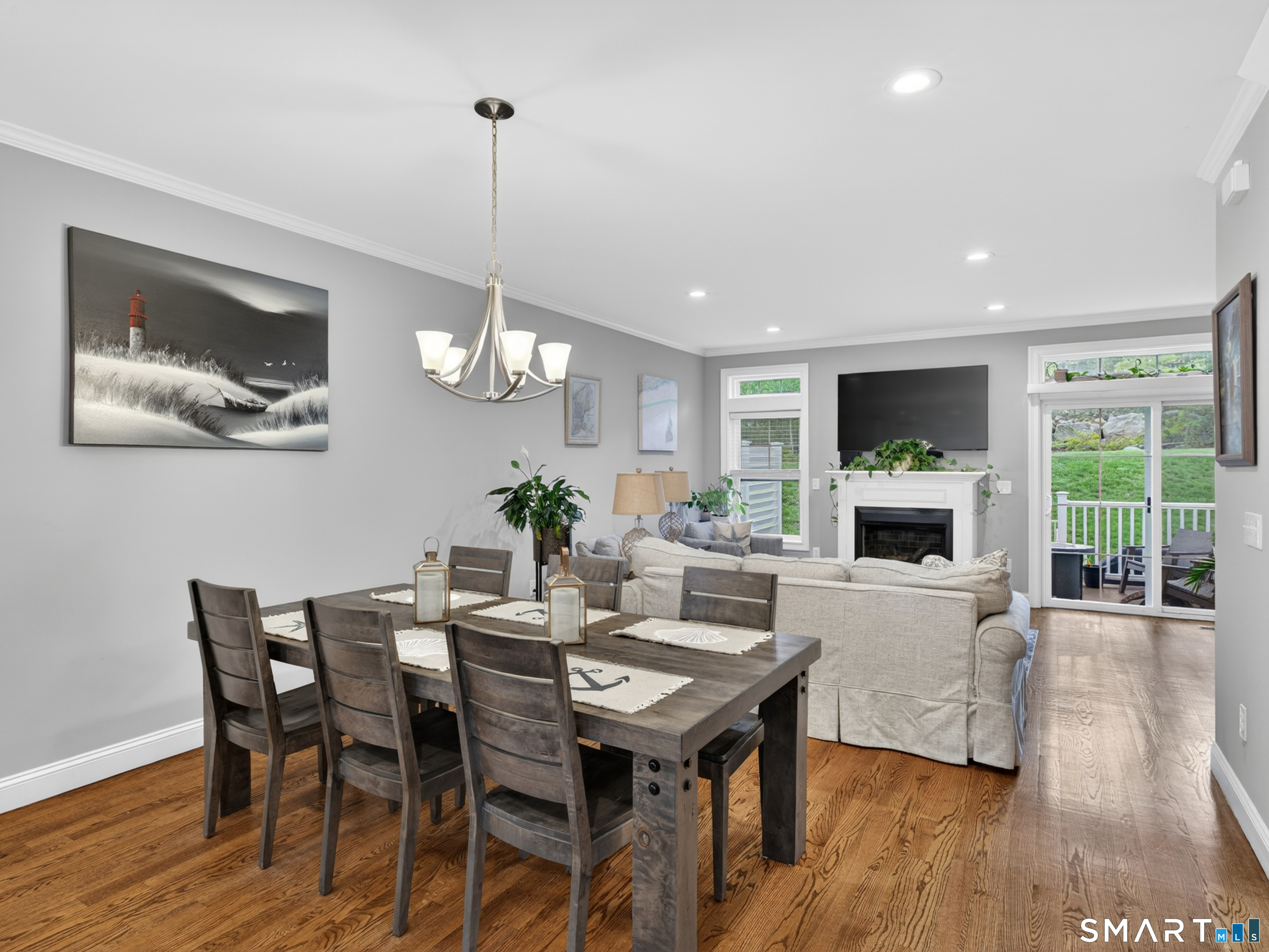 34 Village Crossing, Unit 34 Niantic, CT 06357 - Photo 12 of 38 a view of a dining room with furniture window and wooden floor