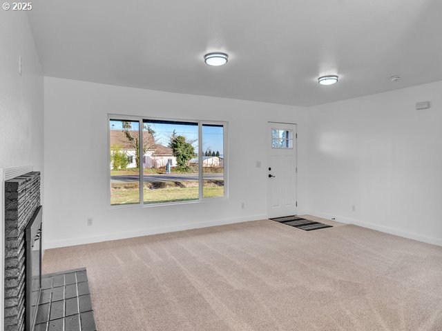2201 East Ellendale Avenue Dallas, OR 97338 - Photo 2 of 29 a view of an empty room with a window