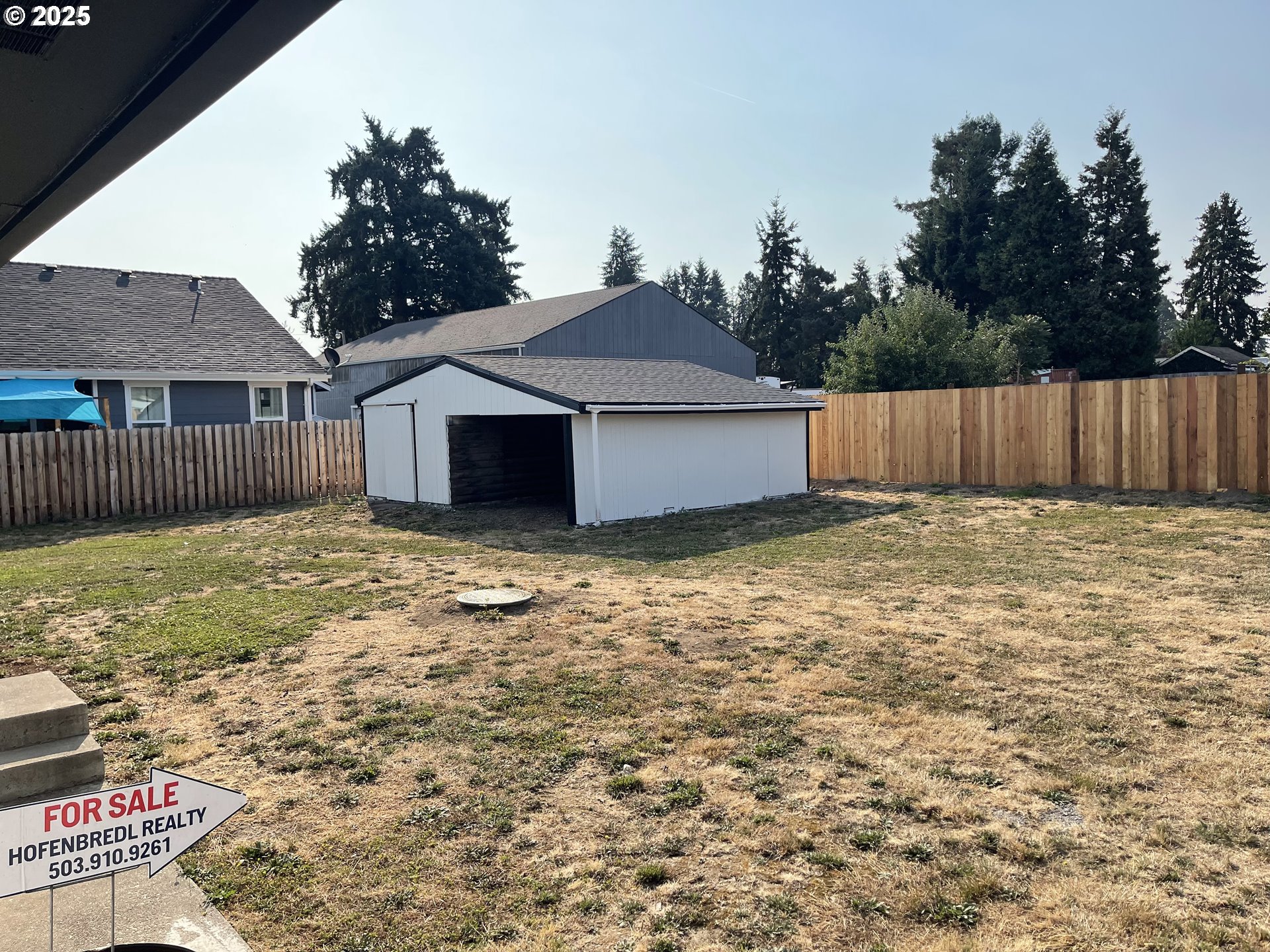 2201 East Ellendale Avenue Dallas, OR 97338 - Photo 27 of 29 a house that has a big yard with wooden fence