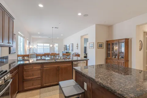 a kitchen with lots of counter top space and dining table