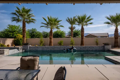 a view of a backyard with a patio and plants