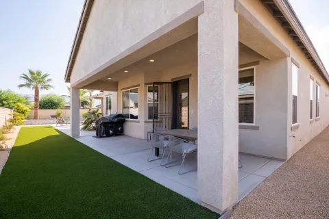a view of an outdoor space and porch with furniture