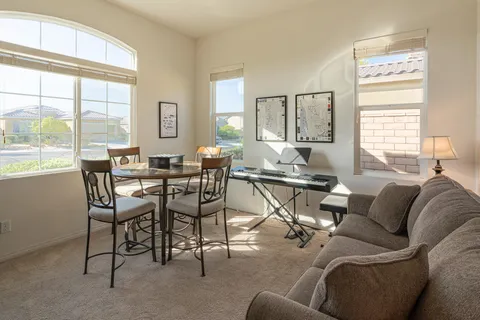 a living room with furniture and a large window