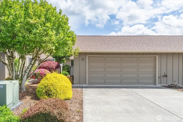a front view of a house with a garage