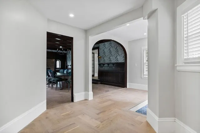 an empty room with closet and windows