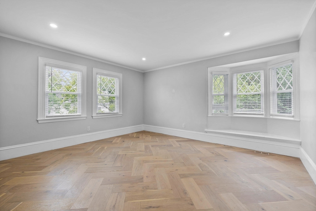 476 Heath Street Brookline, MA 02467 - Photo 19 of 41 a view of an empty room with a window