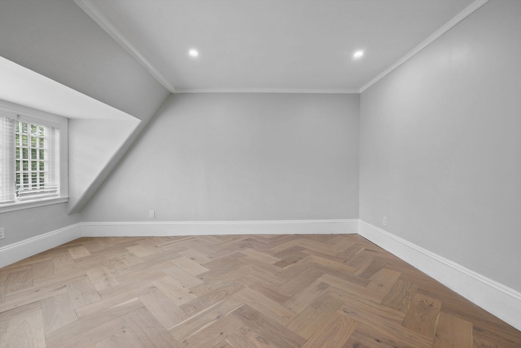 476 Heath Street Brookline, MA 02467 - Photo 26 of 41 wooden floor in an empty room with a window