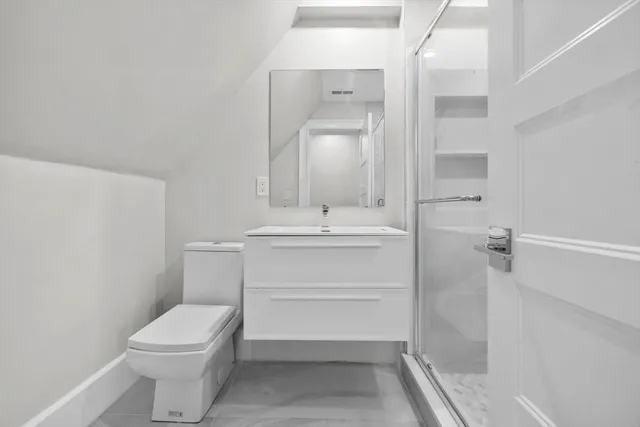 an empty room with a empty space and windows