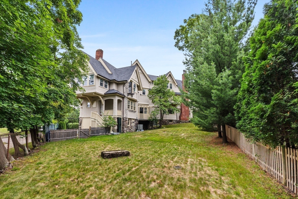 476 Heath Street Brookline, MA 02467 - Photo 37 of 41 a view of a house with a big yard plants and large trees