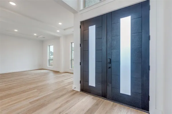 a view of hallway with wooden floor