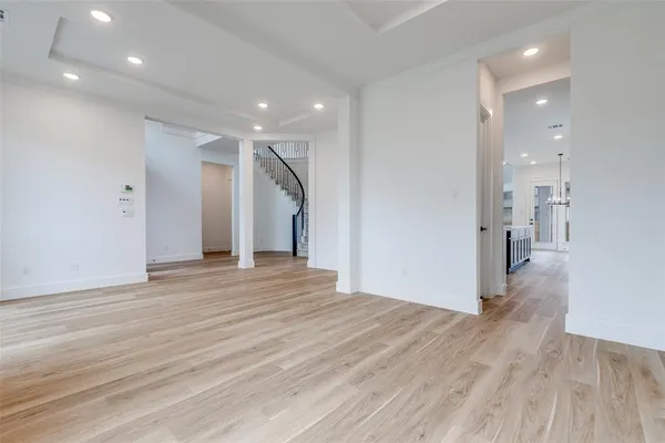 a view of a room with wooden floor