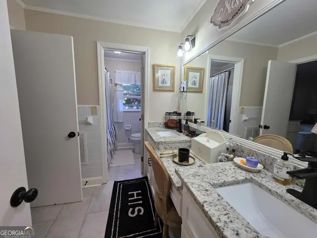 a kitchen with a sink stove and refrigerator