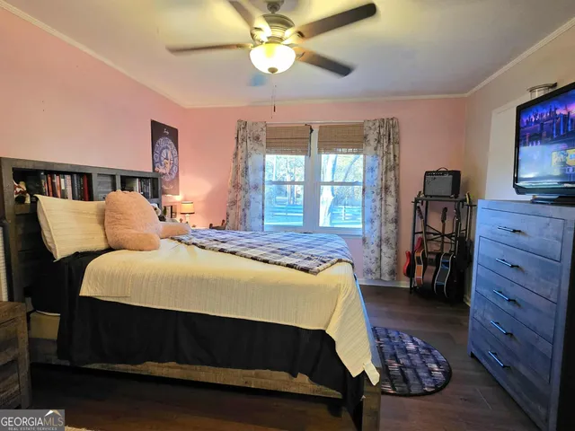 a bed room with a bed and a tv