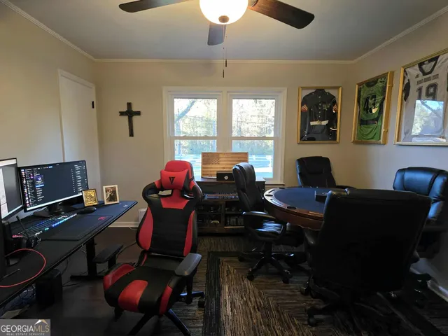 a work room with furniture and a window