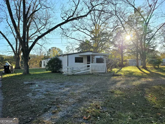a view of walk in closet and wooden floor