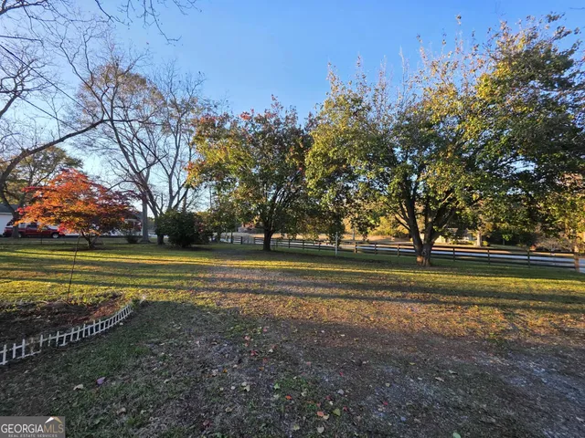 a big yard with large trees