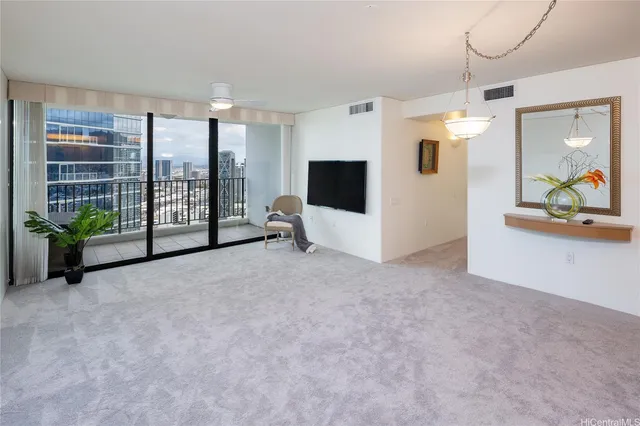 a view of a livingroom with entryway and furniture