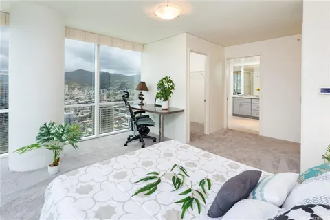 a bed room with a bed and a chair