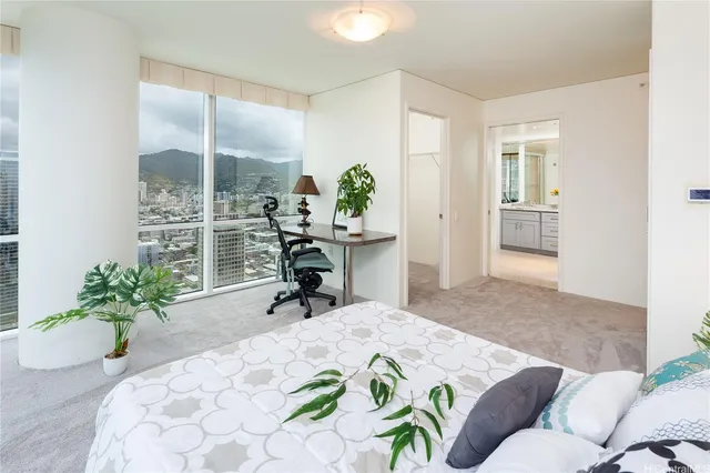 a bed room with a bed and a chair