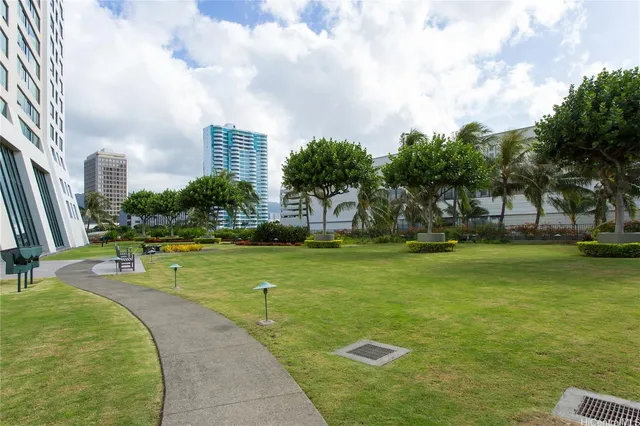 a view of a swimming pool with a yard