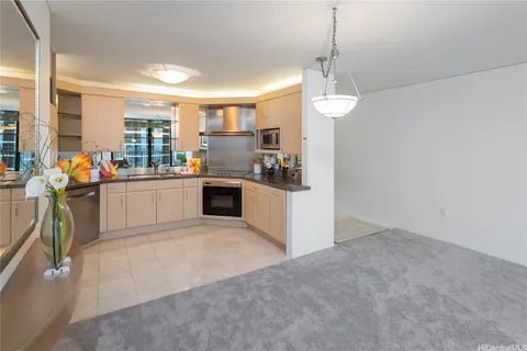 a kitchen with stainless steel appliances granite countertop a stove and a sink