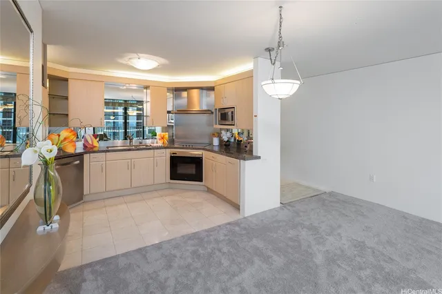 a kitchen with stainless steel appliances granite countertop a stove and a sink