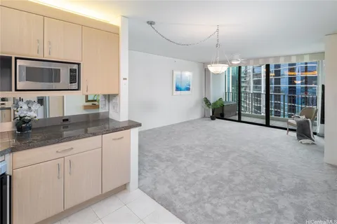 a spacious bathroom with a granite countertop sink a mirror and shower
