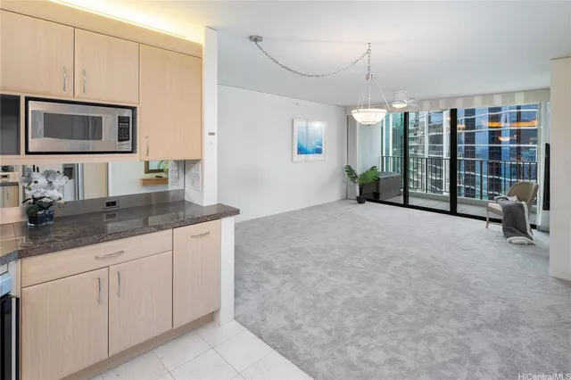 a spacious bathroom with a granite countertop sink a mirror and shower