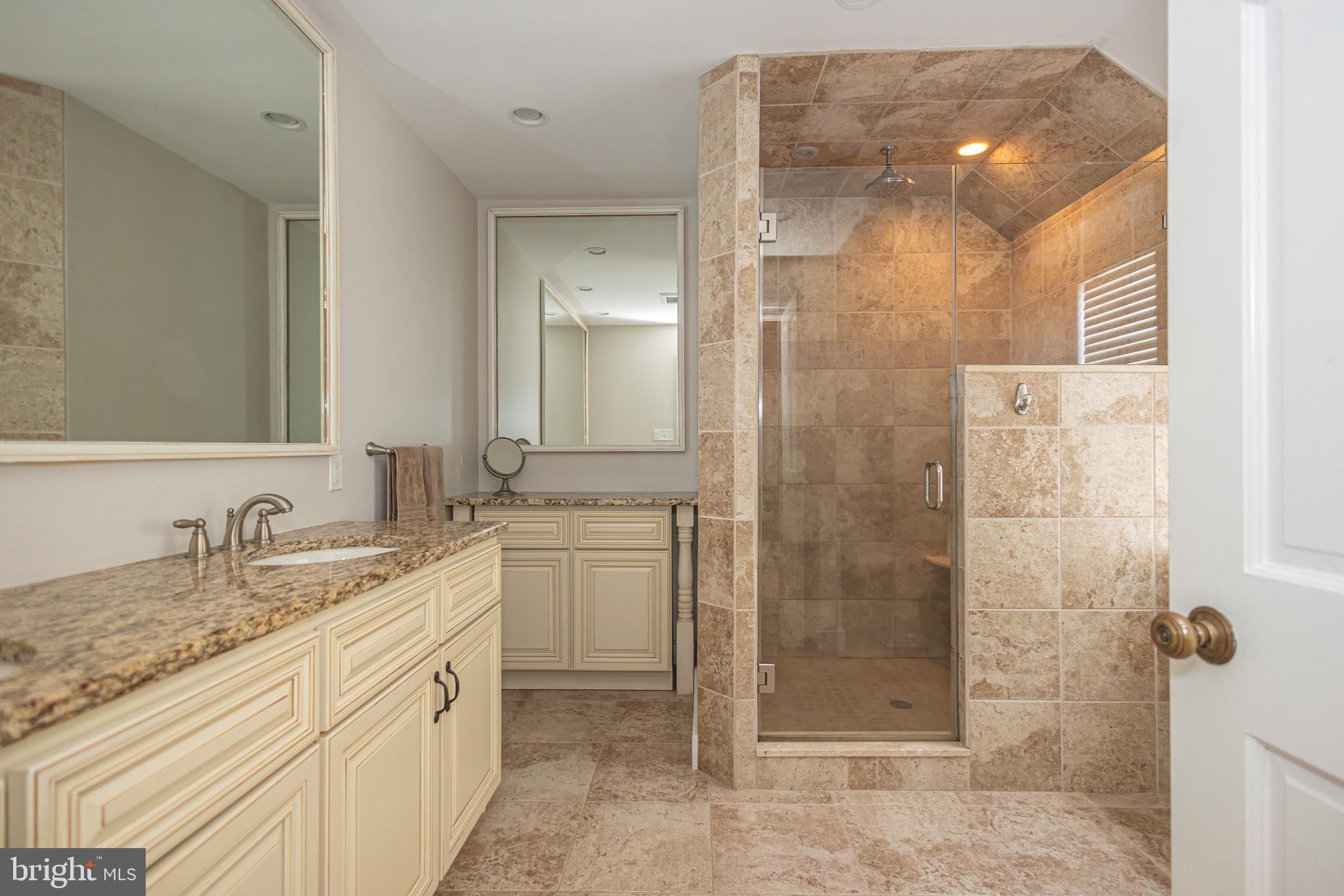 2101 Street Road New Hope, PA 18938 - Photo 51 of 100 a bathroom with a granite countertop sink mirror and shower