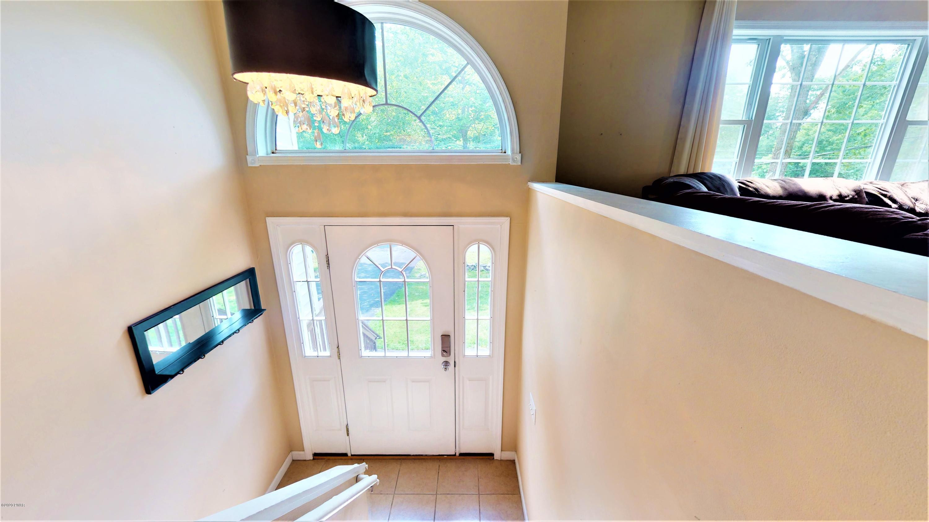 143 Raccoon Road Dingmans Ferry, PA 18328 - Photo 69 of 87 a front view of a house with a window