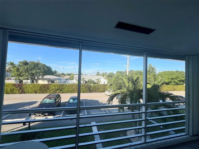 a view of a floor to ceiling window and an outdoor view