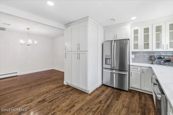 a kitchen with a stove a sink and a microwave