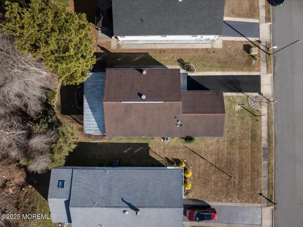 an aerial view of a house with outdoor space