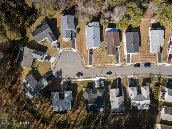 an aerial view of multiple houses with outdoor space