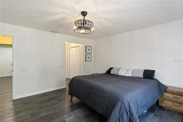 a bedroom with a bed and a table