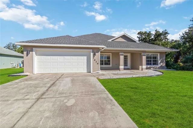 a front view of a house with yard