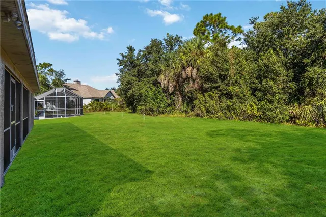 a view of a house with a big yard