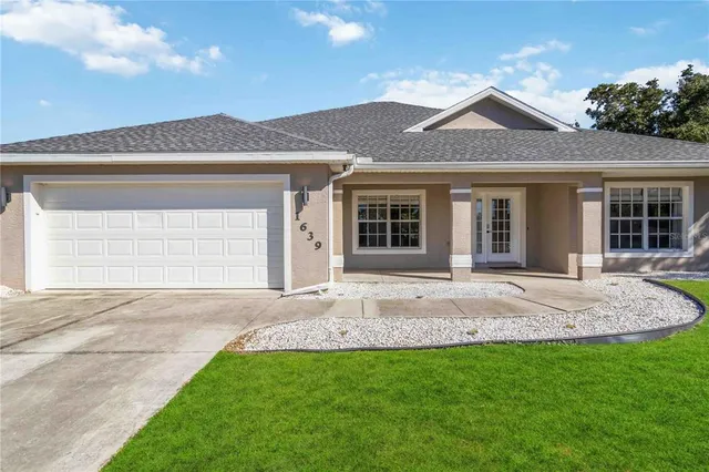 a view of a house with a yard
