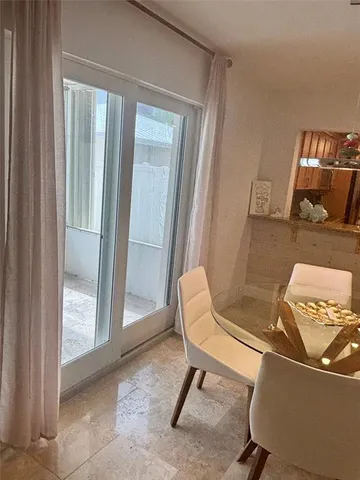 a chair sitting in a room next to a window