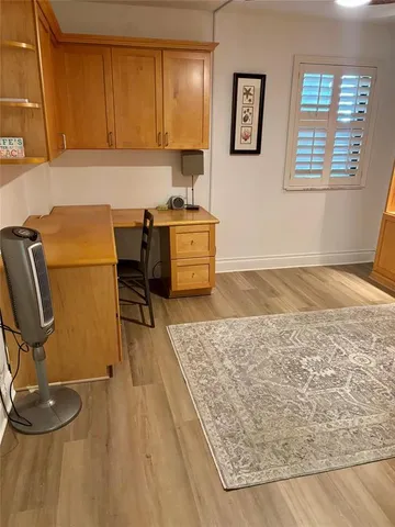a kitchen with a sink and a stove top oven