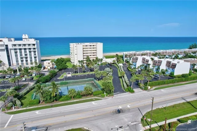 a front view of house and yard with green space