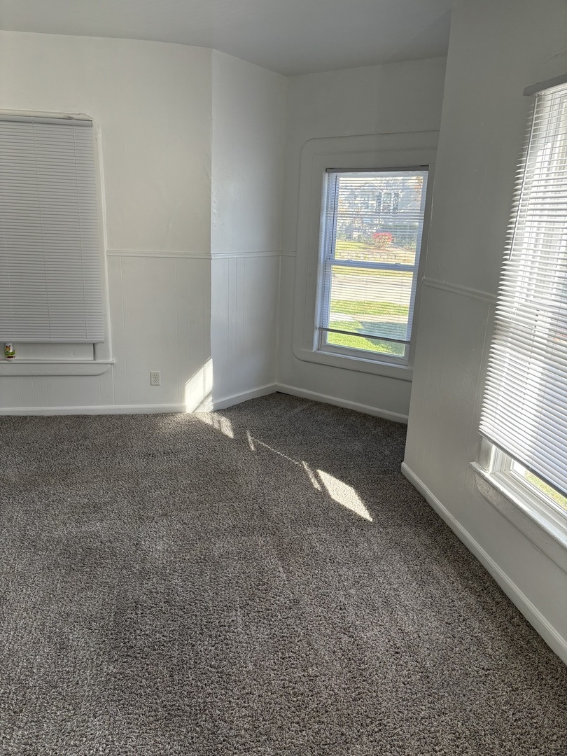 322 Pine Street Joliet, IL 60435 - Photo 6 of 11 an empty room with a window
