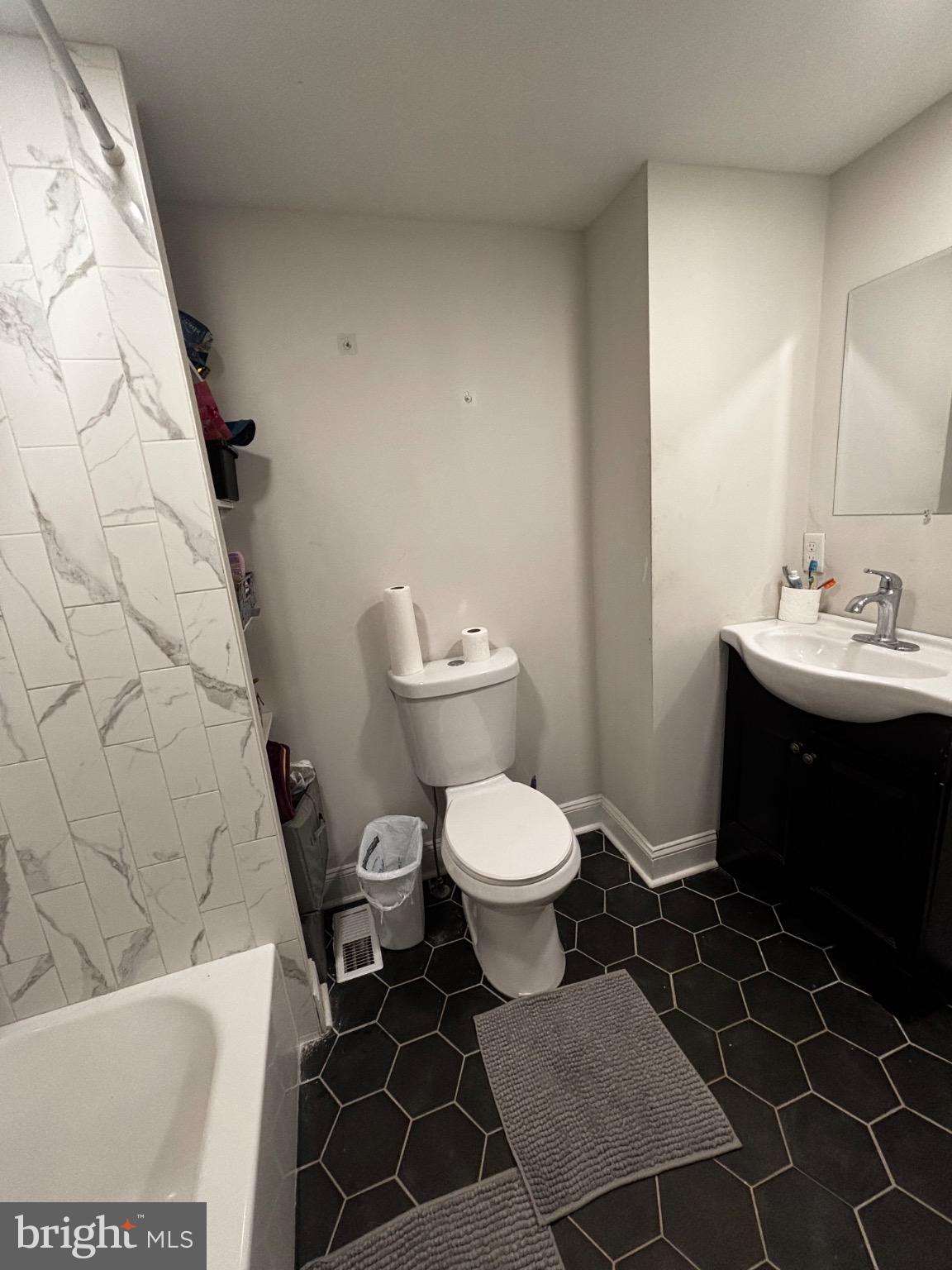 4 3rd Street Brookhaven, PA 19015 - Photo 16 of 21 a bathroom with a sink toilet and shower