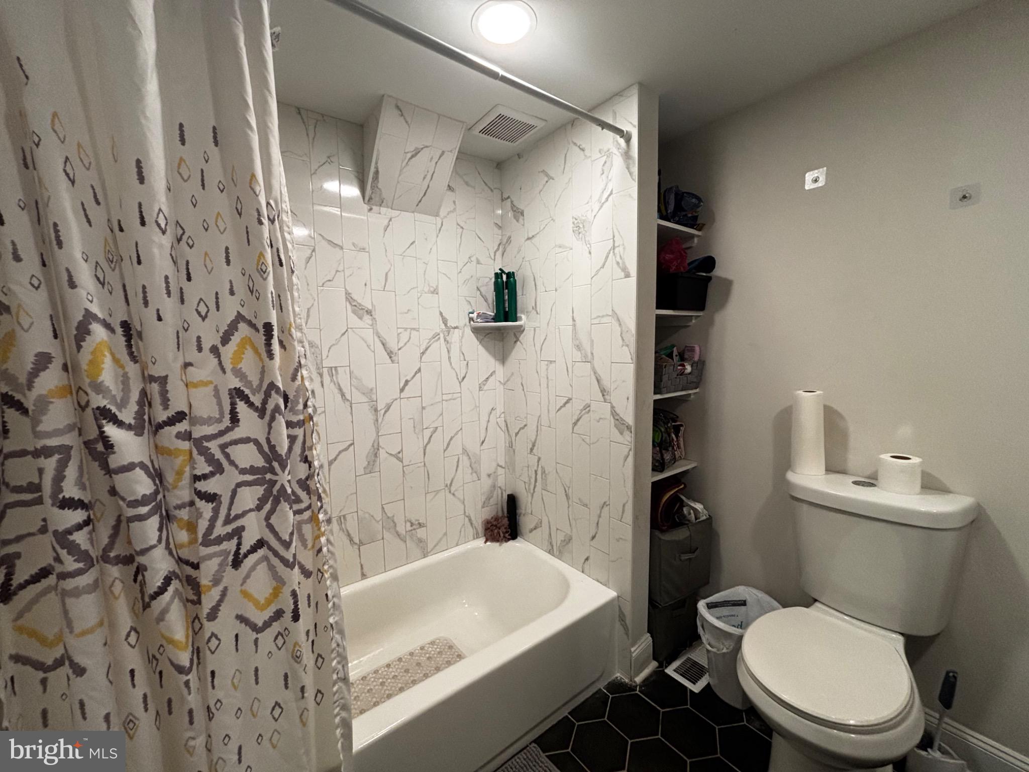 4 3rd Street Brookhaven, PA 19015 - Photo 17 of 21 a bathroom with a toilet and shower