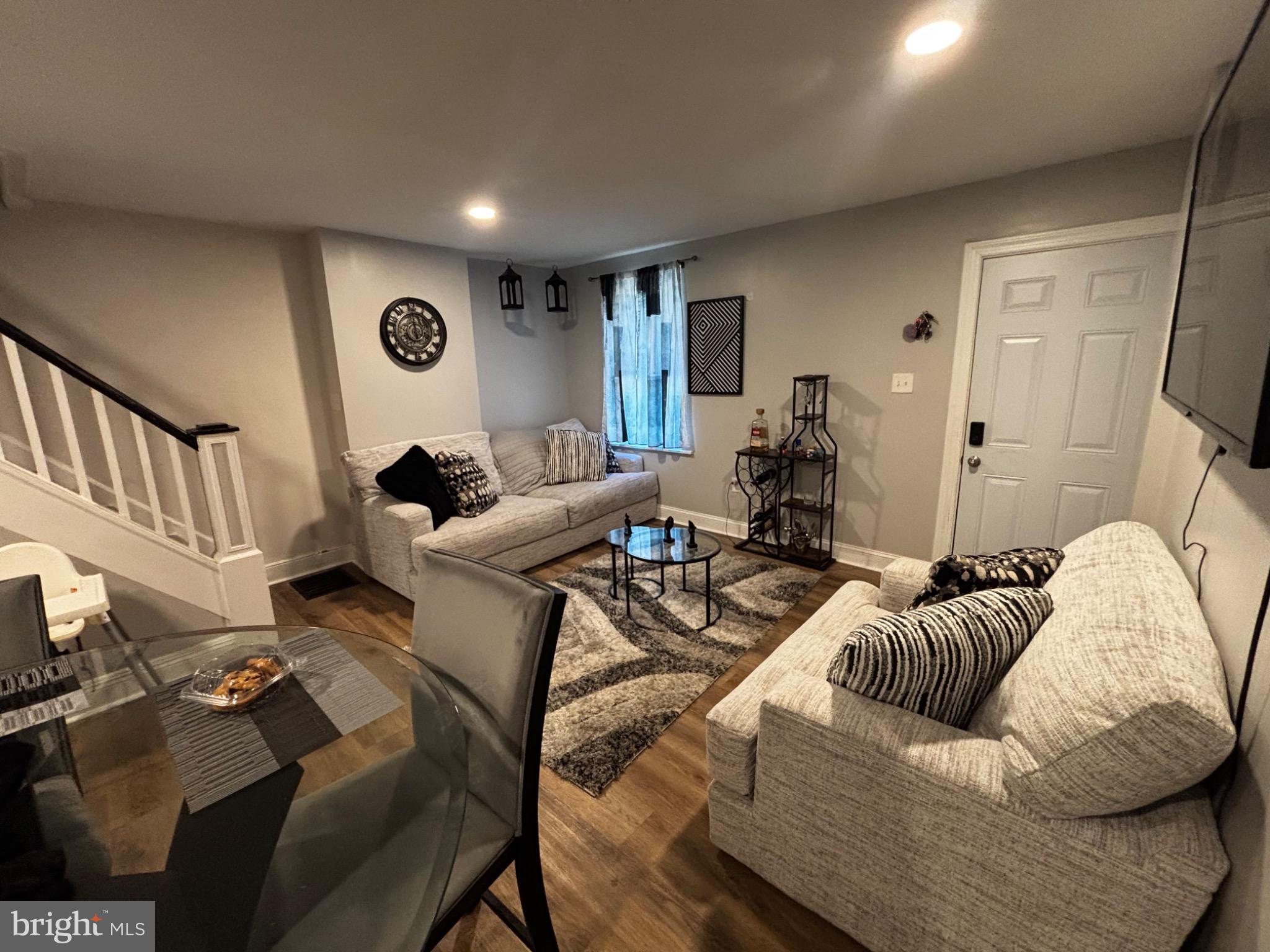 4 3rd Street Brookhaven, PA 19015 - Photo 3 of 21 a living room with furniture and a flat screen tv