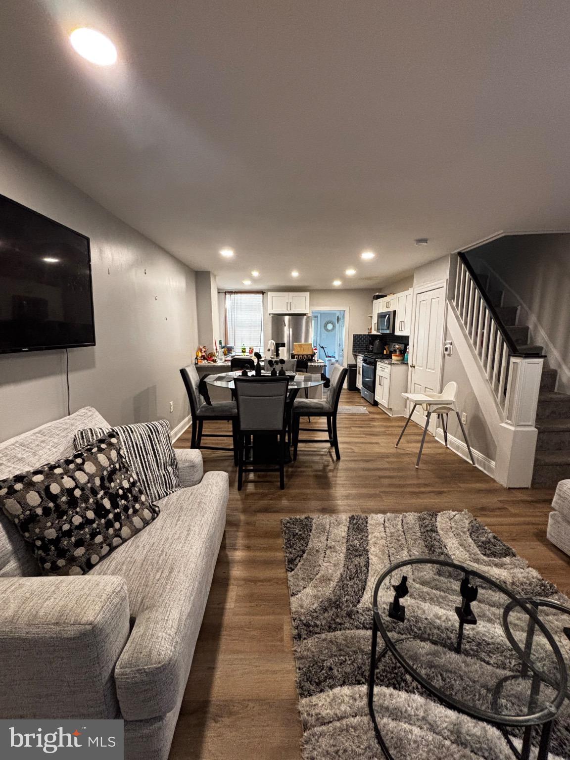 4 3rd Street Brookhaven, PA 19015 - Photo 5 of 21 a living room with furniture and a flat screen tv