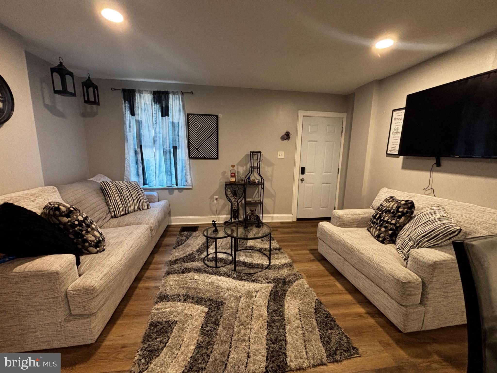 4 3rd Street Brookhaven, PA 19015 - Photo 6 of 21 a living room with furniture and a flat screen tv