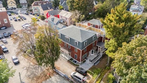 an aerial view of a house with swimming pool