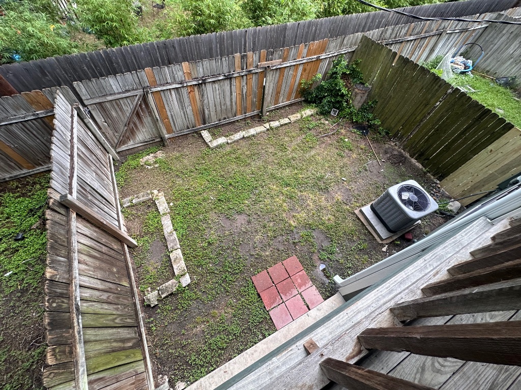 1007 Water Street, Unit 104 Bastrop, TX 78602 - Photo 21 of 23 a view of a backyard with sitting area